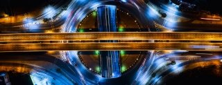abstract time lapse birds eye view of highway overpasses at night